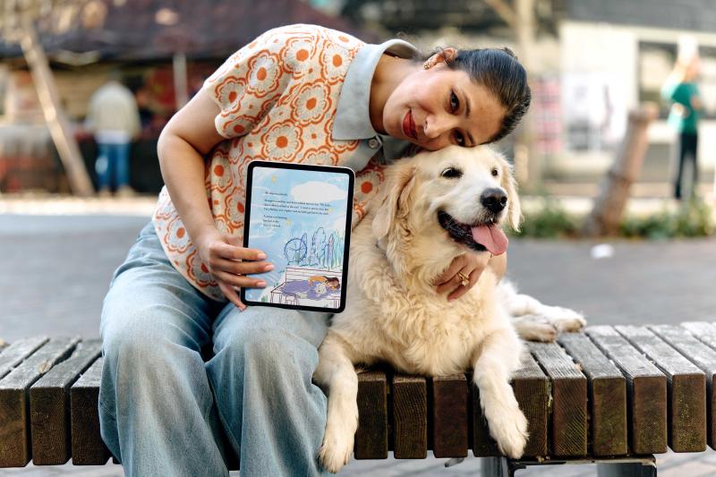 Arwa and Jacko pose with Stay Together on an iPad
